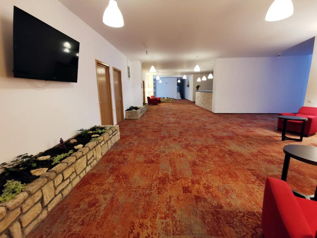 TV a/nebo společenská místnost v ubytování Hotel Mercur