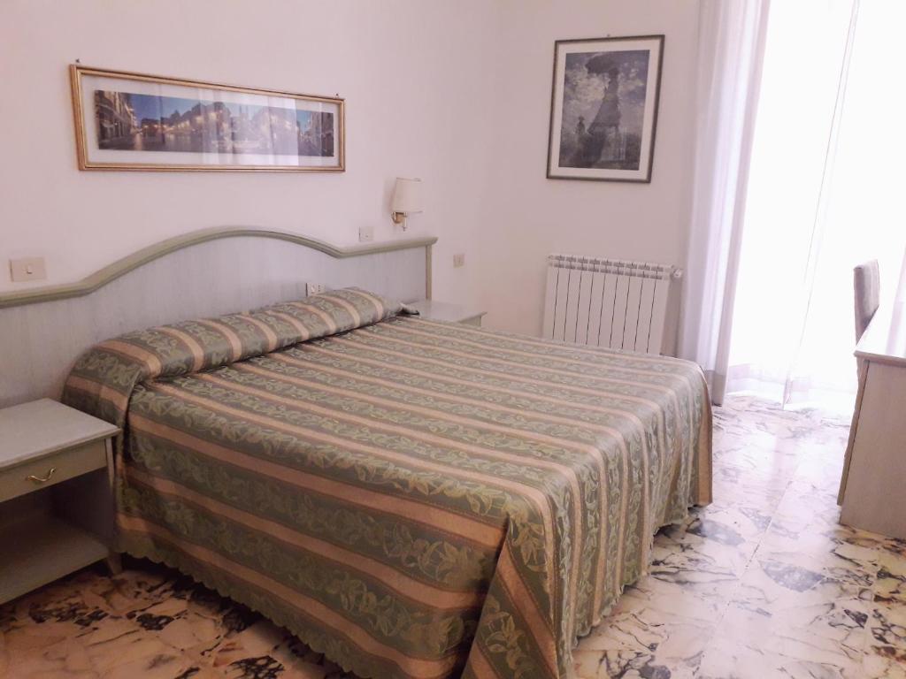 Łóżko lub łóżka w pokoju w obiekcie Gioia Guest House