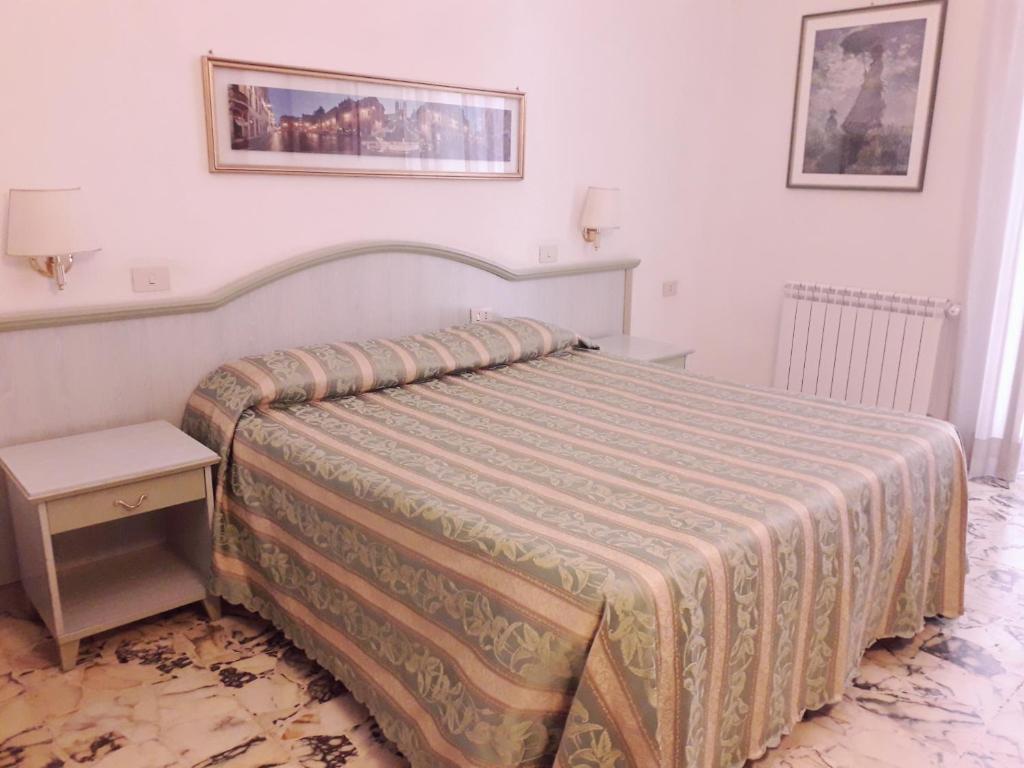 Łóżko lub łóżka w pokoju w obiekcie Gioia Guest House