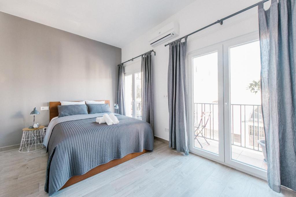 Postel nebo postele na pokoji v ubytování AD32 Apartamento Luminoso a los pies del Puente de Triana