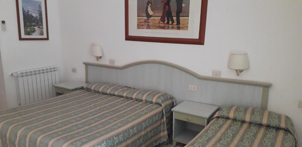 Łóżko lub łóżka w pokoju w obiekcie Gioia Guest House