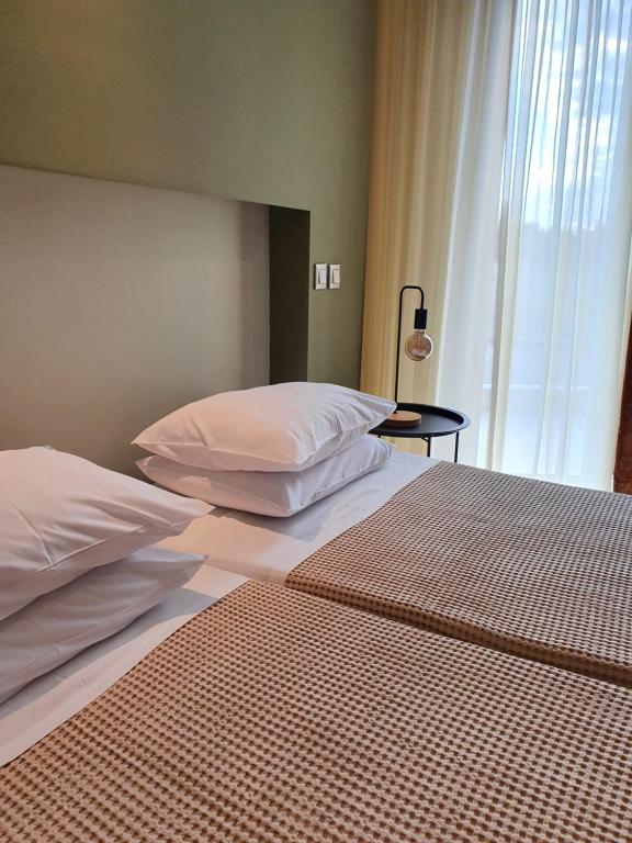 Postel nebo postele na pokoji v ubytování Hotel Aphroditi Island Park