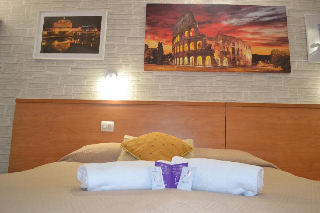 Postel nebo postele na pokoji v ubytování A&F Colosseo