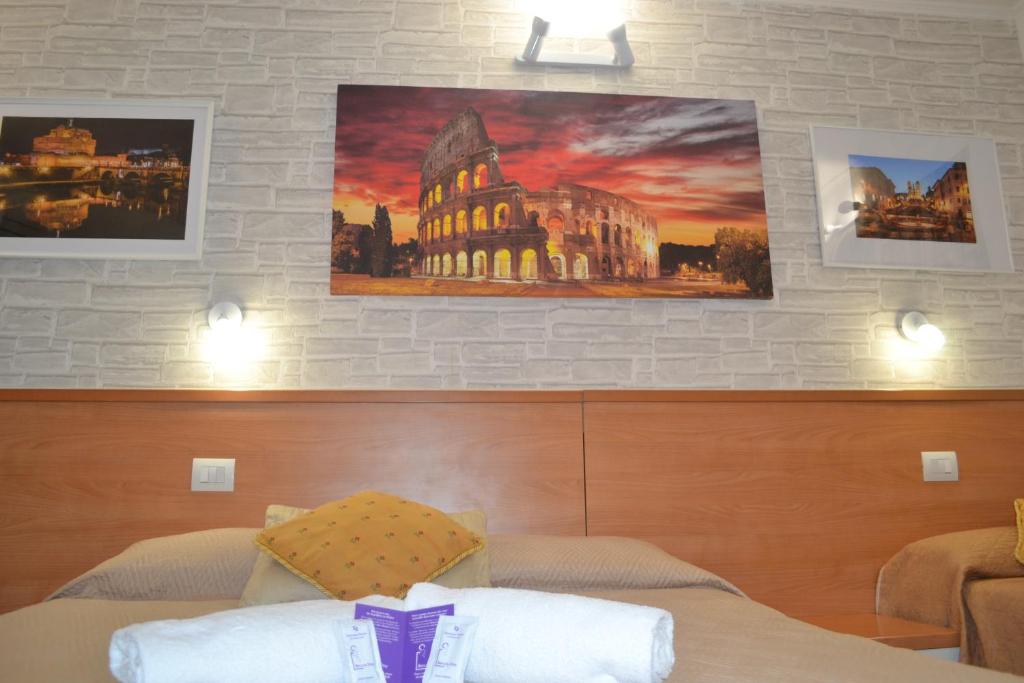 Postel nebo postele na pokoji v ubytování A&F Colosseo