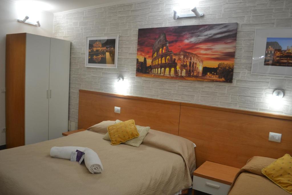 Postel nebo postele na pokoji v ubytování A&F Colosseo