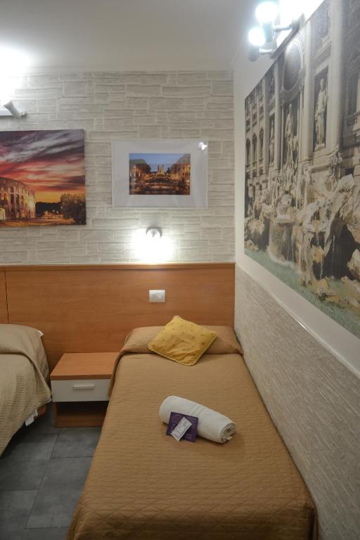 Postel nebo postele na pokoji v ubytování A&F Colosseo
