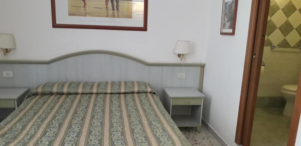 Łóżko lub łóżka w pokoju w obiekcie Gioia Guest House