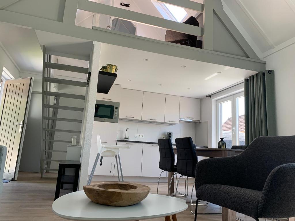 a living room and kitchen with a loft at Duinendaele 166 in De Panne