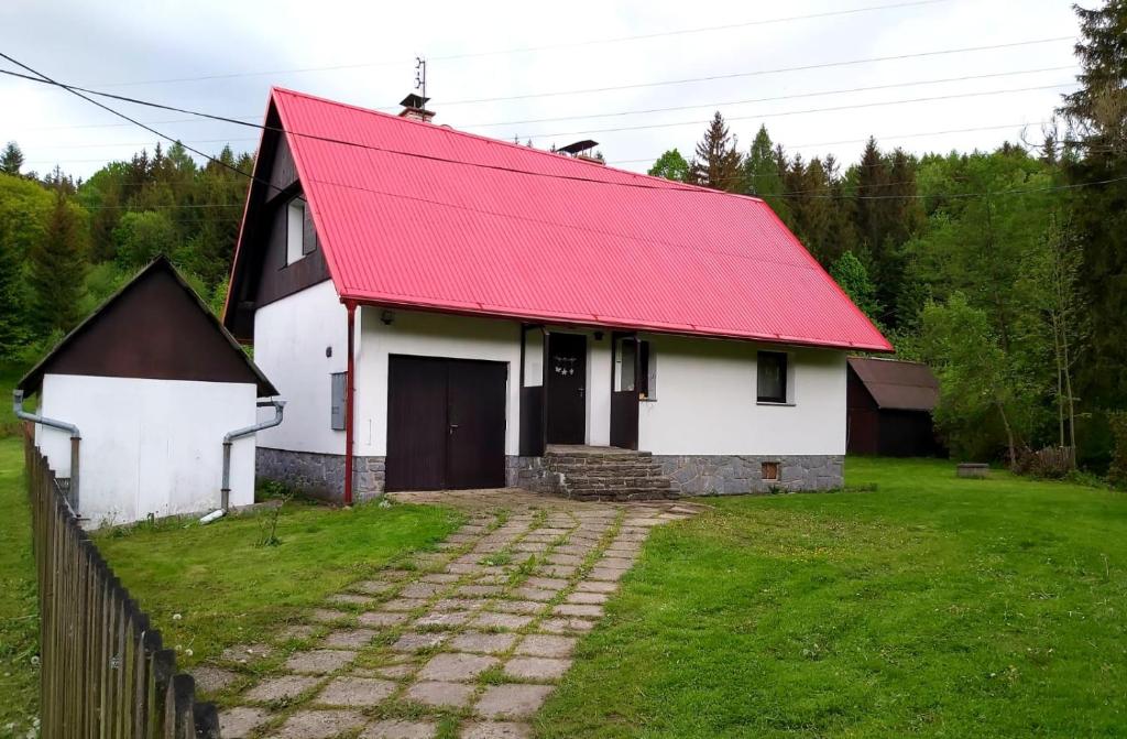 a white and red house with a red roof at Jirkova chata in Lipova Lazne