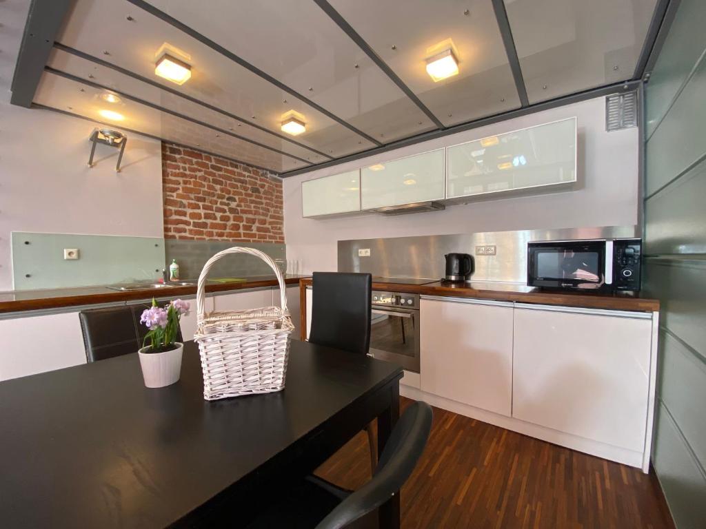 Kuchyň nebo kuchyňský kout v ubytování P&J Apartments Floriańska