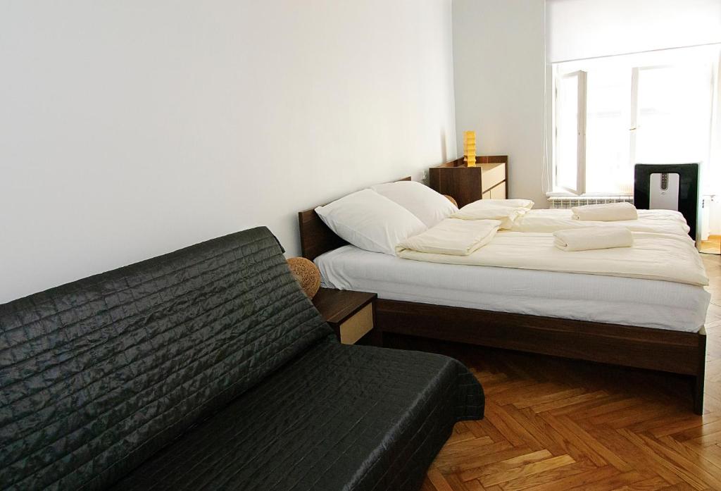 Postel nebo postele na pokoji v ubytování P&J Apartments Floriańska