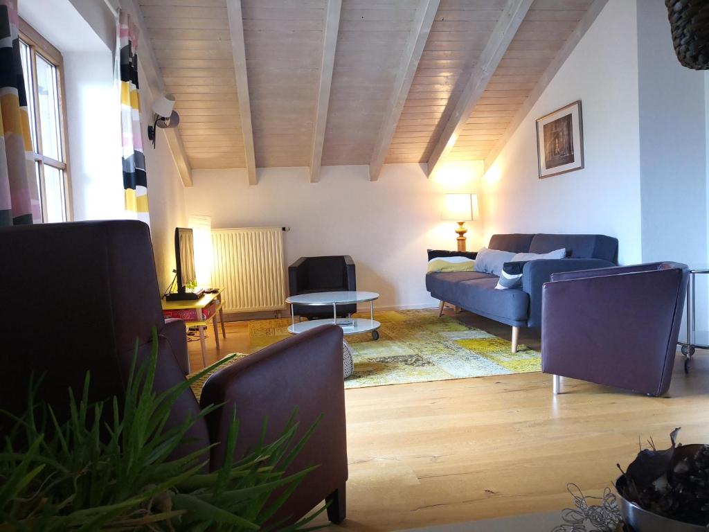 a living room with a couch and a table at Jungholz Erlebnis in Jungholz