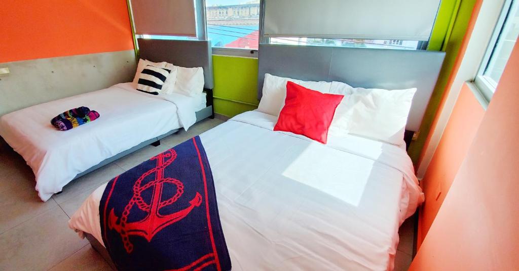 Una cama o camas en una habitación de Conturce Hostel