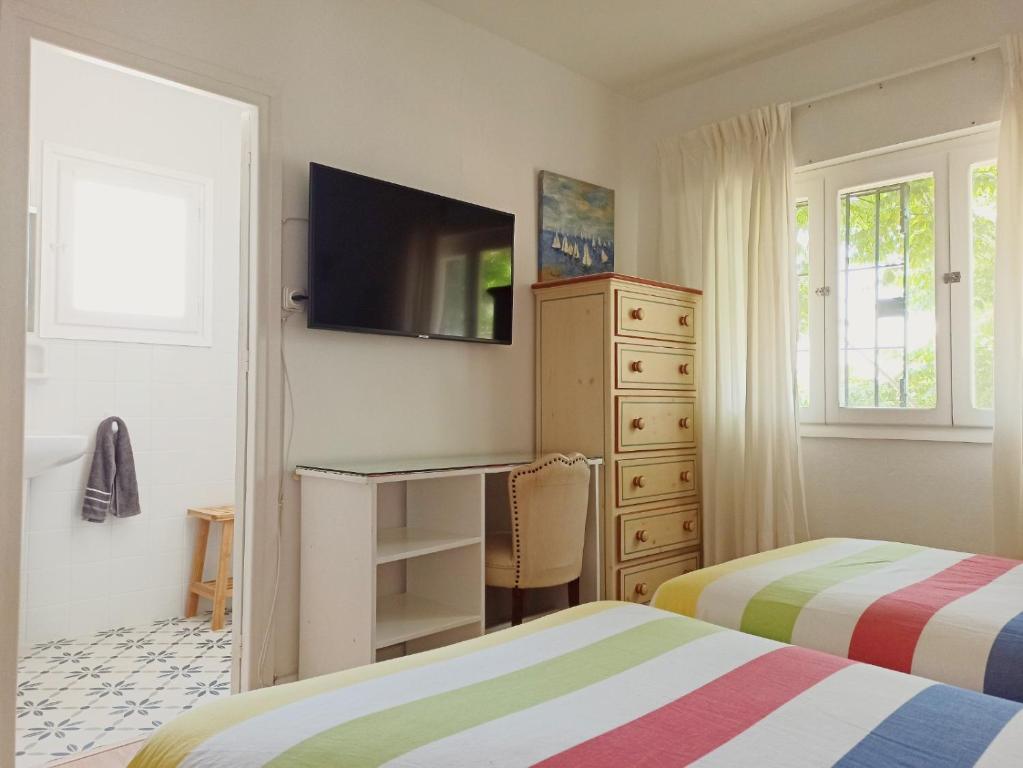 TV a/nebo společenská místnost v ubytování Casa Sanabria habitaciones privadas en una vivienda particular