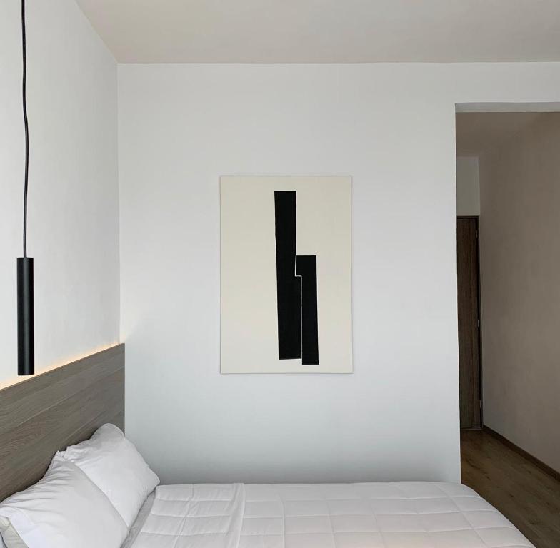Postel nebo postele na pokoji v ubytování Hotel Blanco Pachuca