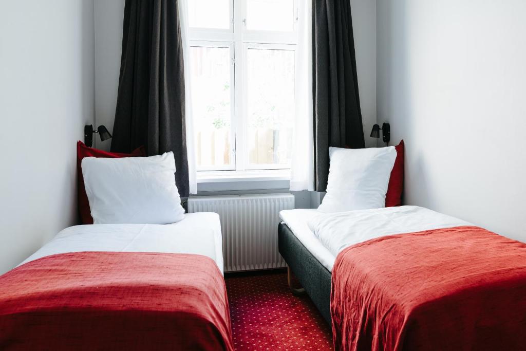 Postel nebo postele na pokoji v ubytování City Hotel Nebo