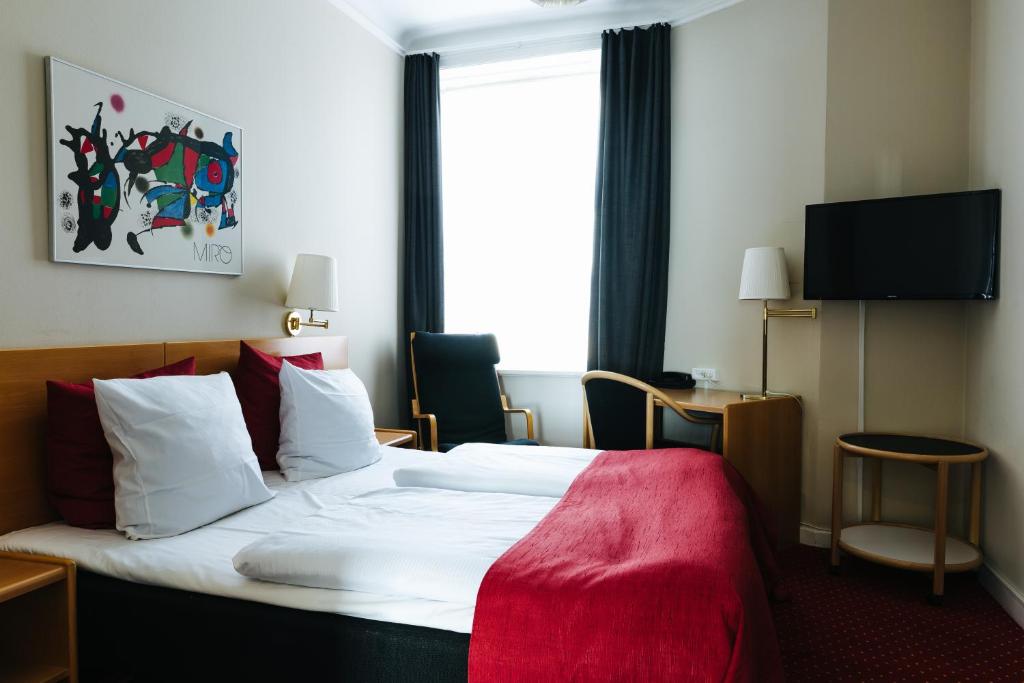 Postel nebo postele na pokoji v ubytování City Hotel Nebo
