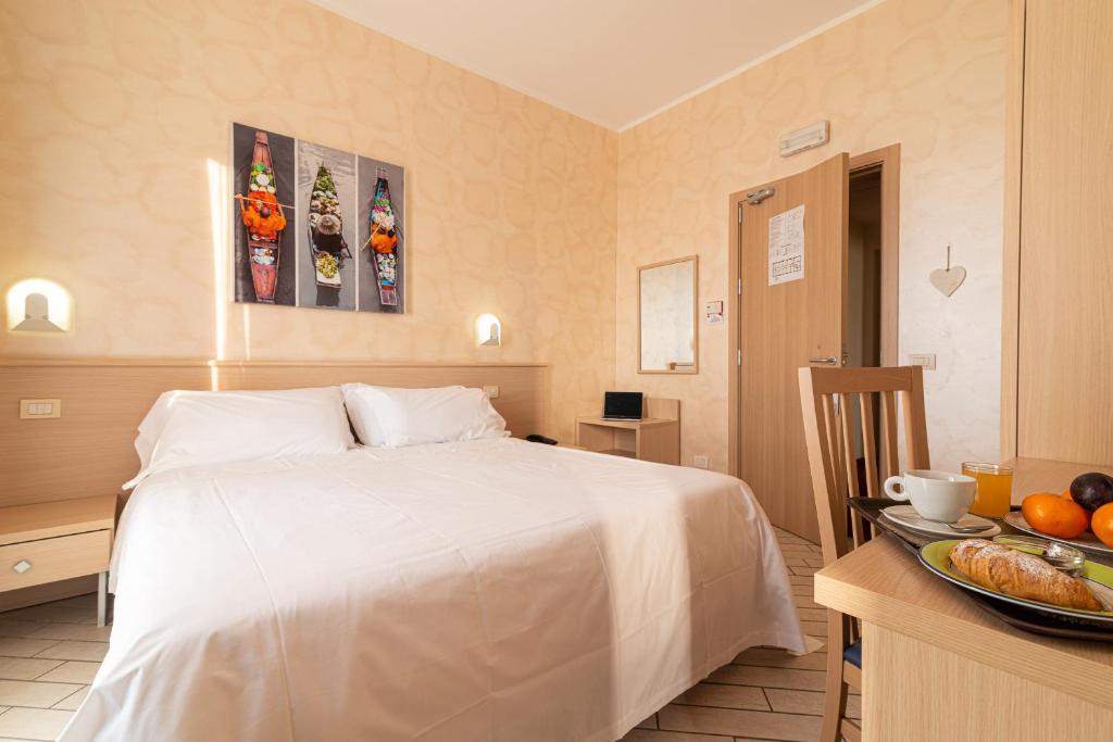 Tempat tidur dalam kamar di Hotel Mirandola