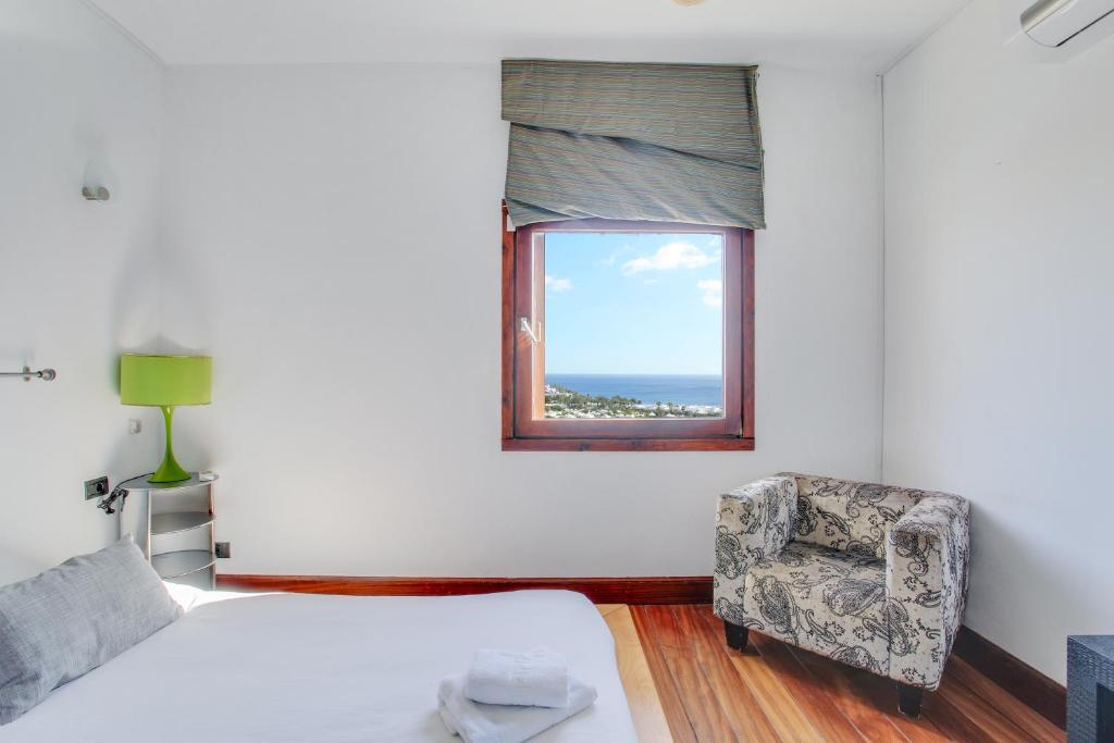 A bed or beds in a room at Villa Abaego