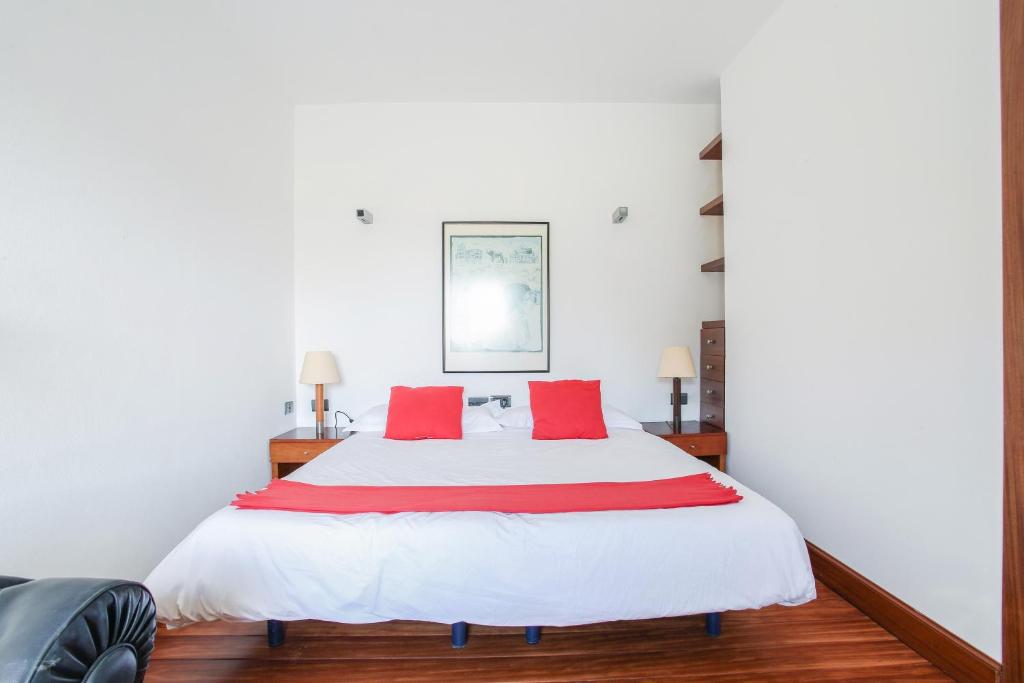 A bed or beds in a room at Villa Abaego