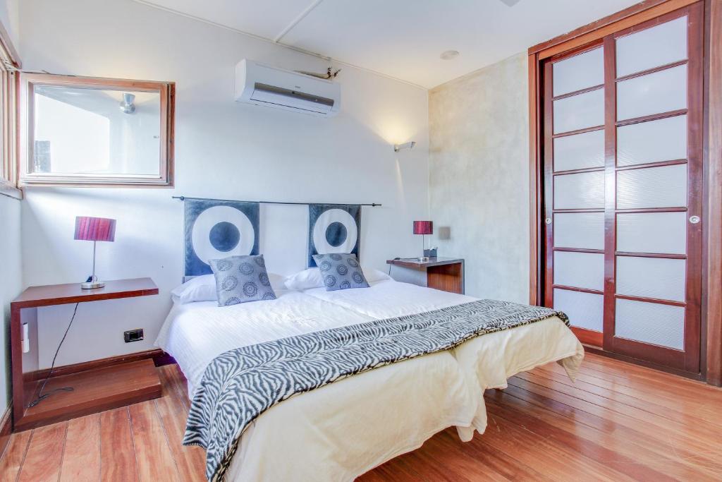 A bed or beds in a room at Villa Abaego
