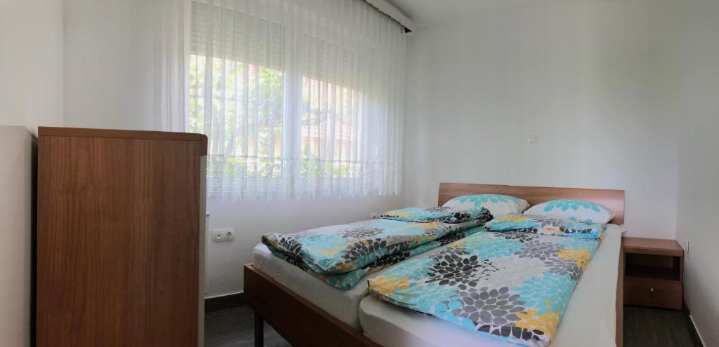 Postel nebo postele na pokoji v ubytování Apartments Andrej - Optuj