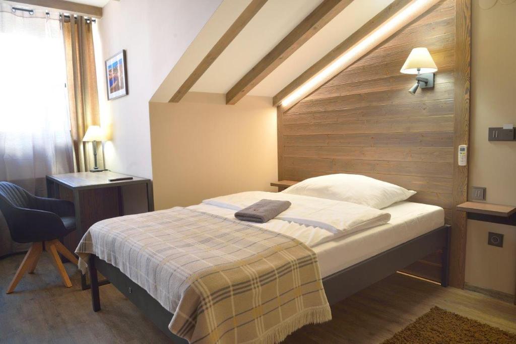 Postel nebo postele na pokoji v ubytování Hotel Via Ironia