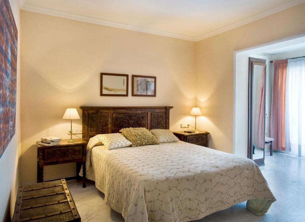 Postel nebo postele na pokoji v ubytování Hotel El Molí