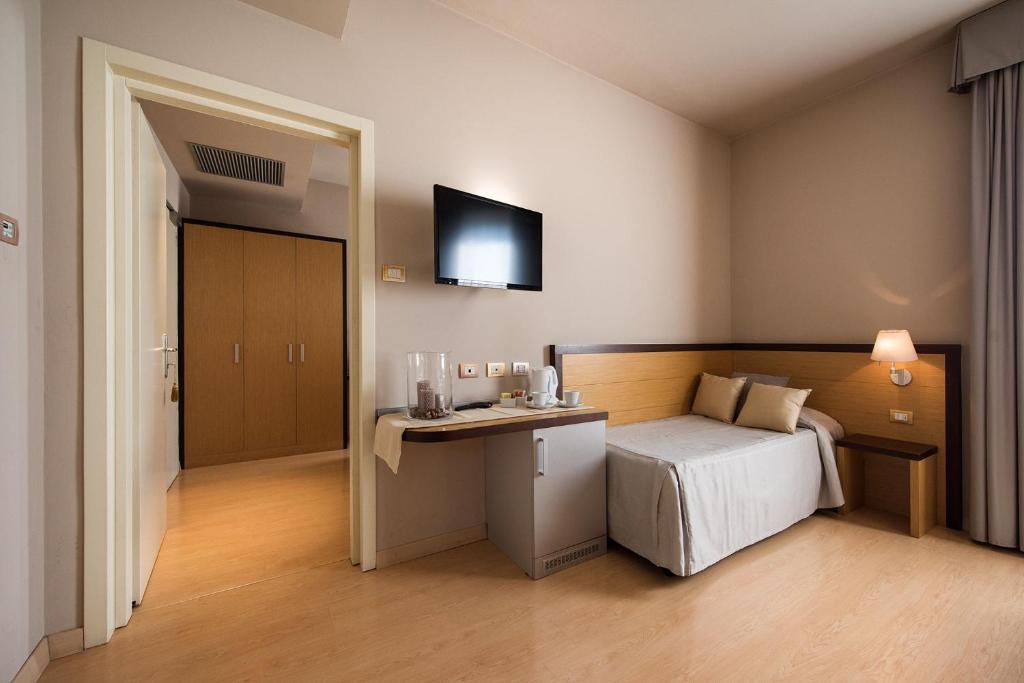Posteľ alebo postele v izbe v ubytovaní Hotel San Martino