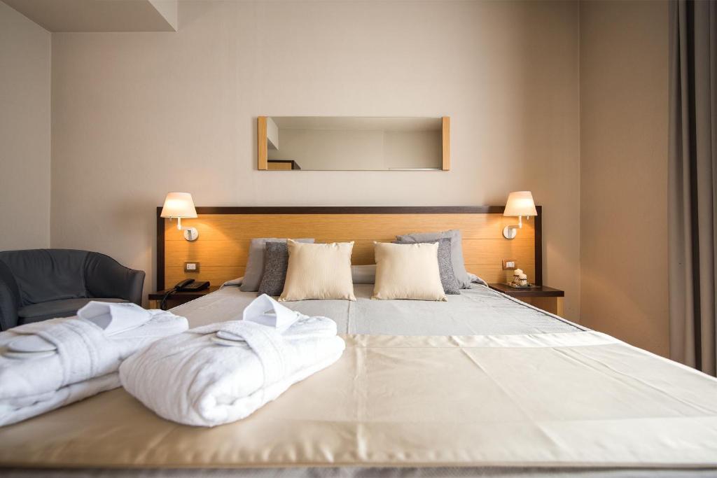 Posteľ alebo postele v izbe v ubytovaní Hotel San Martino