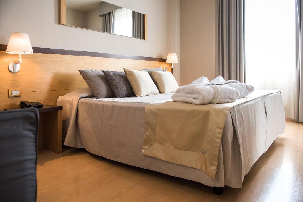 Posteľ alebo postele v izbe v ubytovaní Hotel San Martino