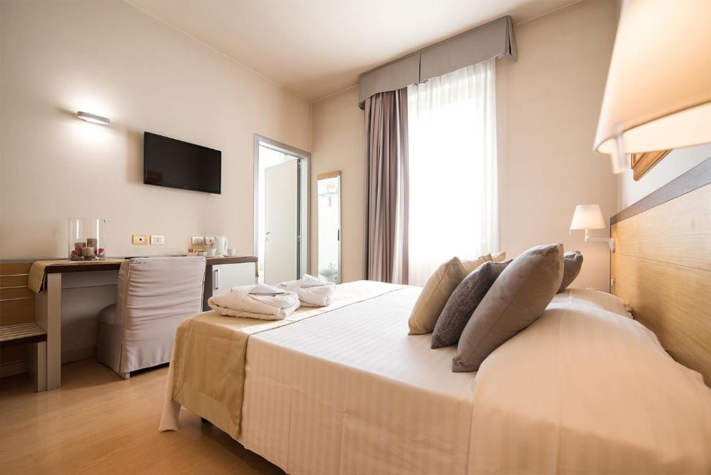 Posteľ alebo postele v izbe v ubytovaní Hotel San Martino