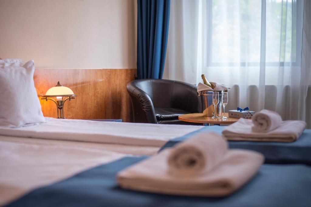 Postel nebo postele na pokoji v ubytování Hotel Marami
