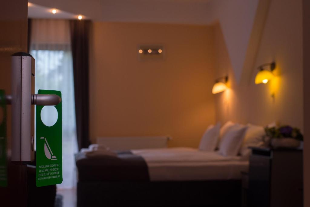 Postel nebo postele na pokoji v ubytování Hotel Marami
