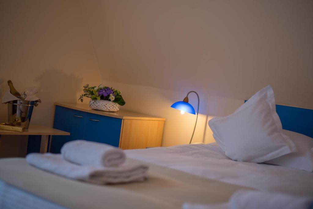 Postel nebo postele na pokoji v ubytování Hotel Marami