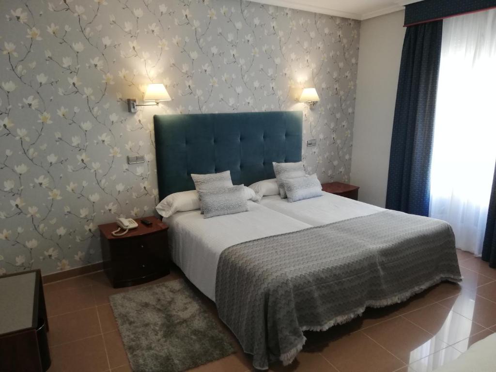 Postel nebo postele na pokoji v ubytování Hotel Las Moradas