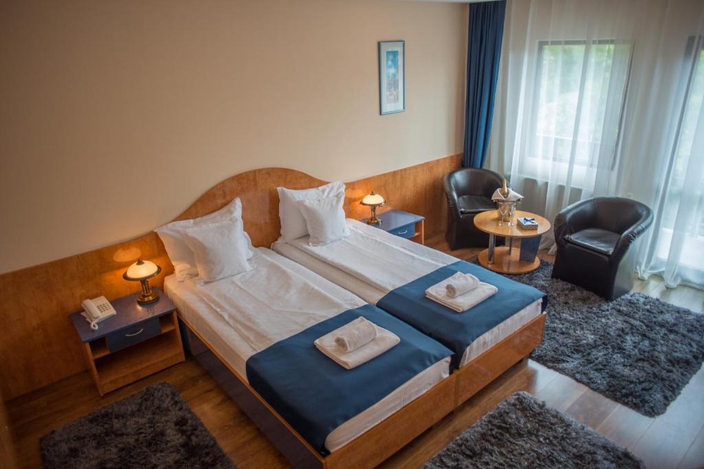Postel nebo postele na pokoji v ubytování Hotel Marami