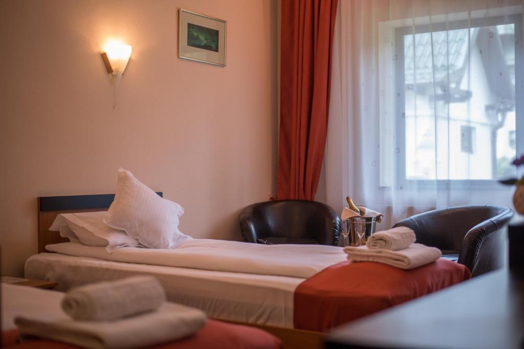 Postel nebo postele na pokoji v ubytování Hotel Marami