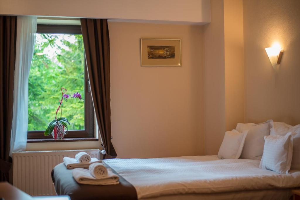 Postel nebo postele na pokoji v ubytování Hotel Marami
