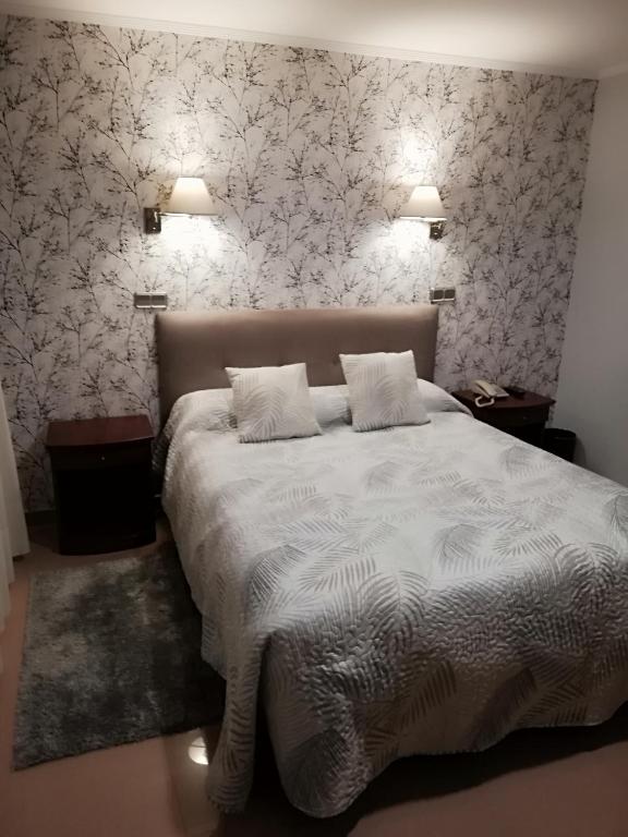 Postel nebo postele na pokoji v ubytování Hotel Las Moradas