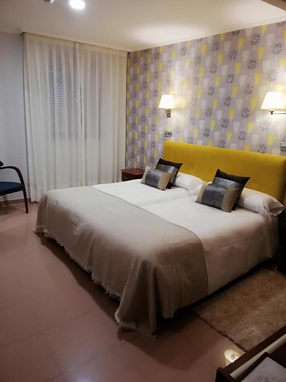 Postel nebo postele na pokoji v ubytování Hotel Las Moradas