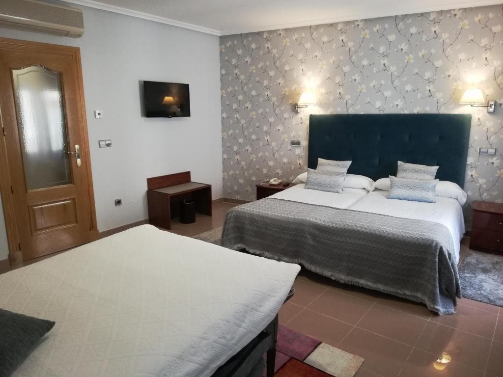 Postel nebo postele na pokoji v ubytování Hotel Las Moradas