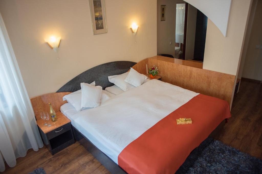 Postel nebo postele na pokoji v ubytování Hotel Marami