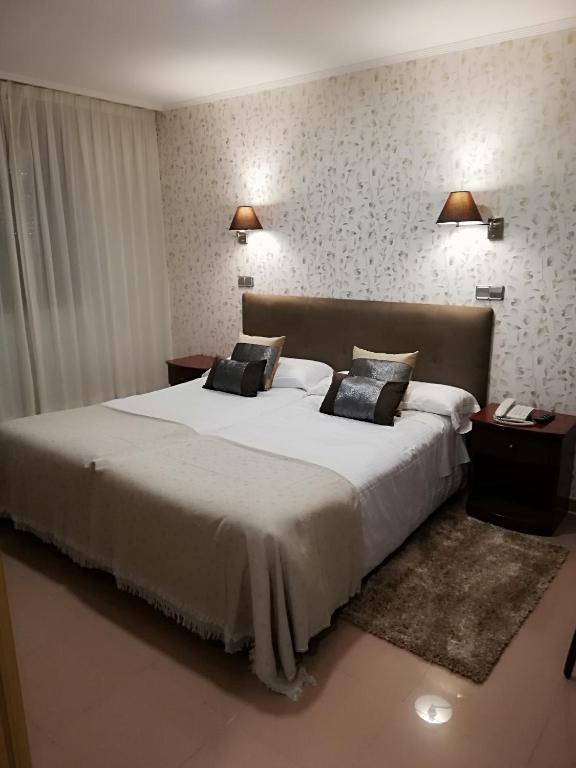 Postel nebo postele na pokoji v ubytování Hotel Las Moradas