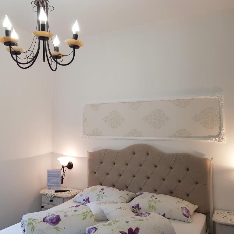 Posteľ alebo postele v izbe v ubytovaní Garni Villa Tyrol - Adults Only