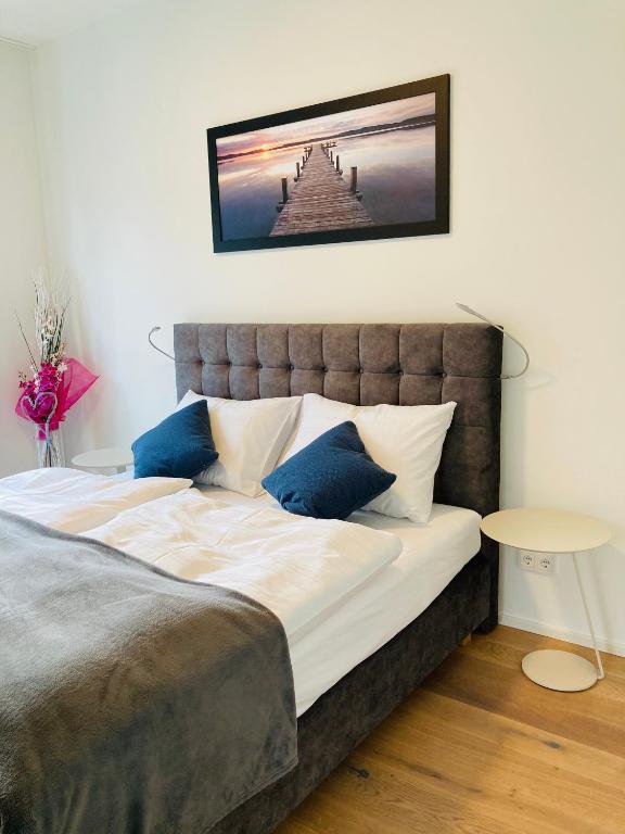 Postel nebo postele na pokoji v ubytování Hermitage Apartments
