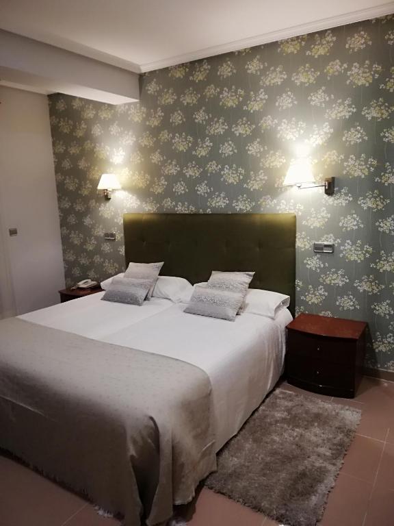 Postel nebo postele na pokoji v ubytování Hotel Las Moradas