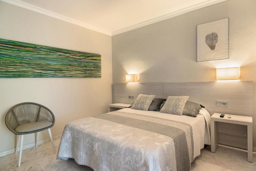 Postel nebo postele na pokoji v ubytování Hotel El Molí