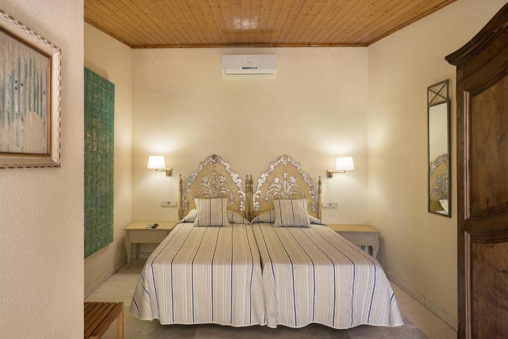 Postel nebo postele na pokoji v ubytování Hotel El Molí