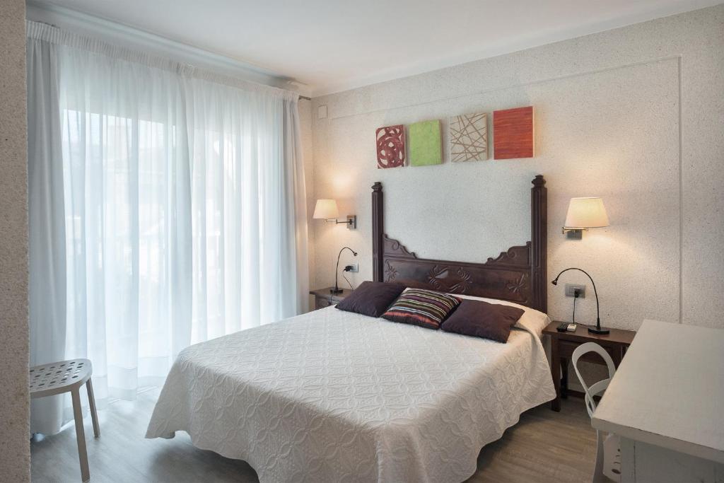 Postel nebo postele na pokoji v ubytování Hotel El Molí